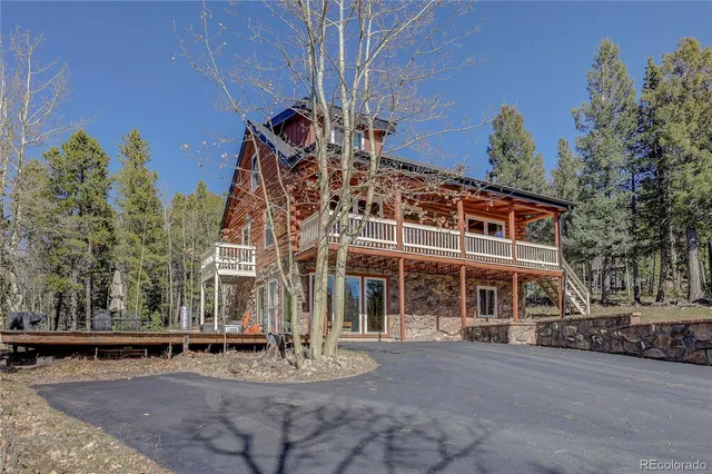 front view of a building with a garden