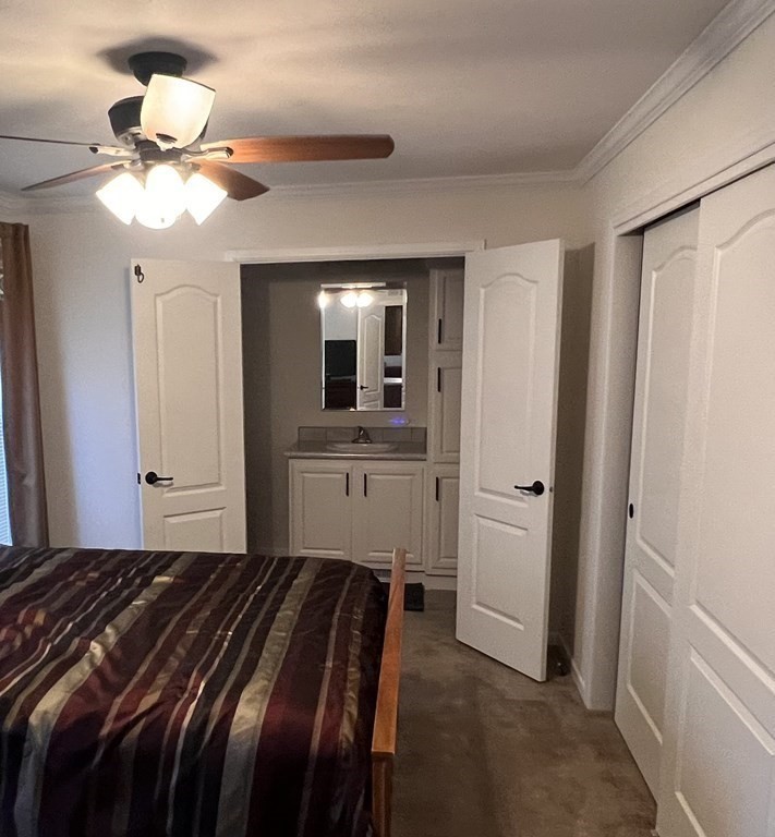 14 Holiday Road Holbrook, MA 02343 - Photo 6 of 10 a bedroom with a bed and a chandelier