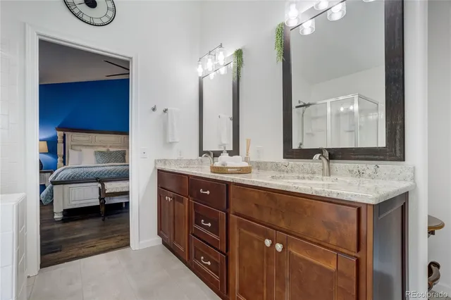 a bathroom with a sink double vanity and a mirror