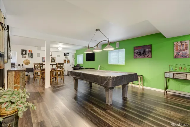 a room with furniture and wooden floor