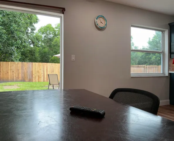 a kitchen with a counter top appliances and cabinets