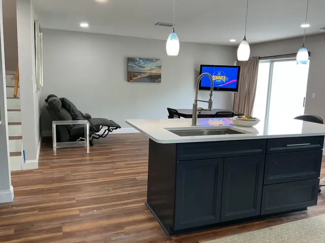 a kitchen with stainless steel appliances granite countertop a stove and a refrigerator