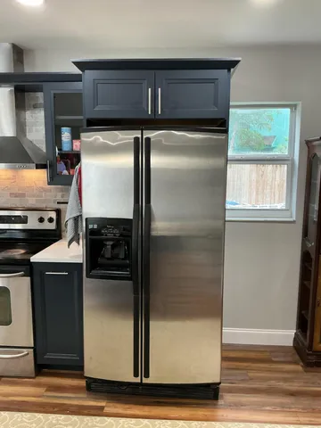 a view of entryway with wooden floor and stairs