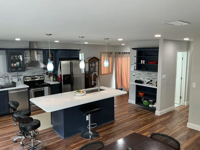 a view of a bathroom with wooden floor