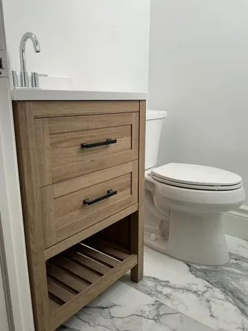 a view of a yard with a wooden fence