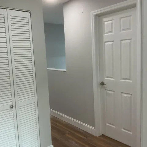 a view of a livingroom with wooden floor