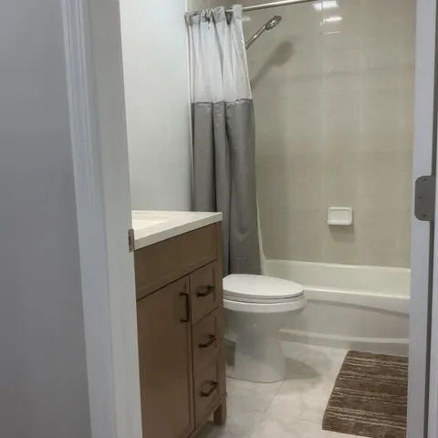 an empty room with wooden floor and closet