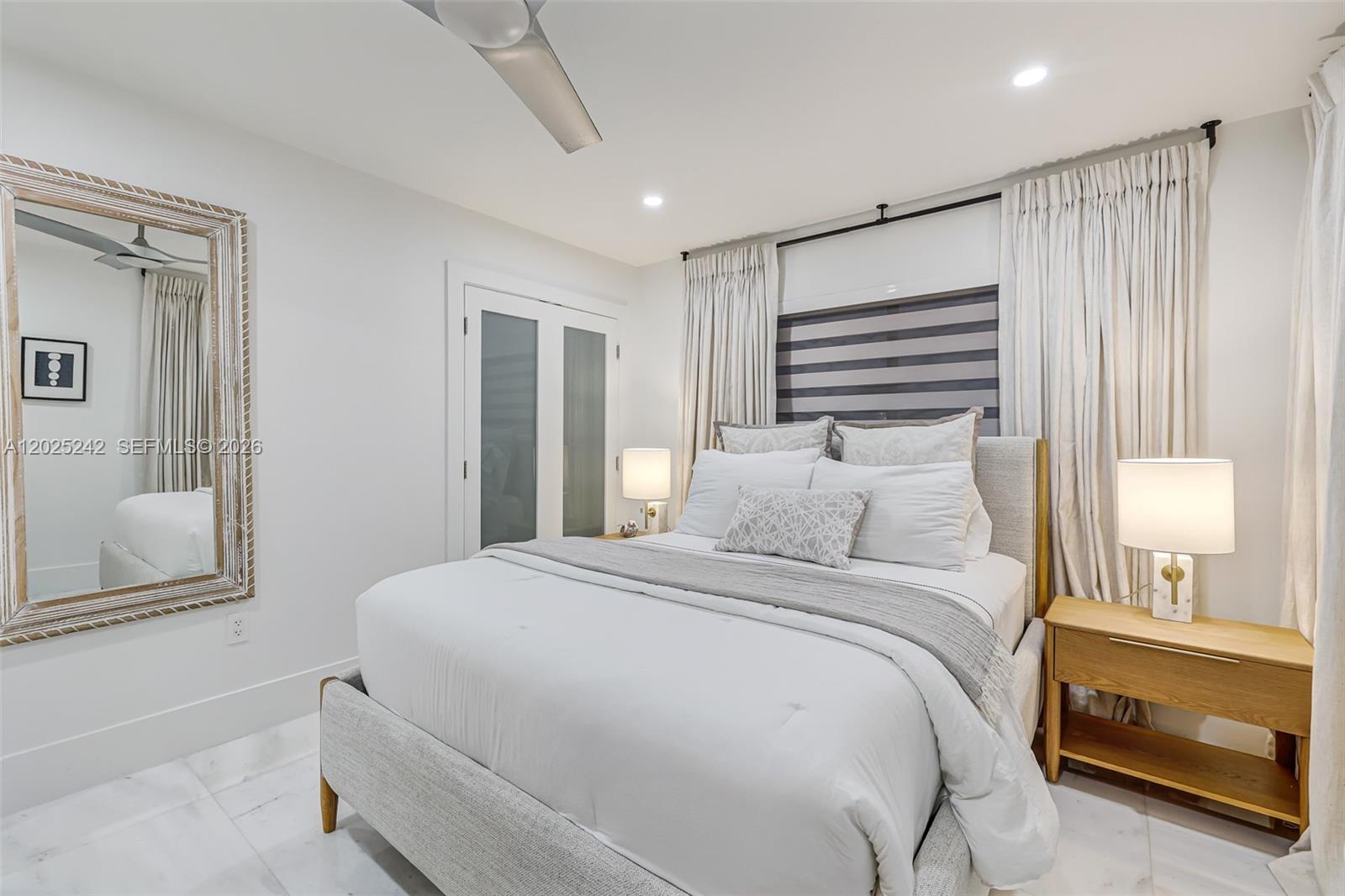 8761 Southwest 56th Street Miami, FL 33165 - Photo 39 of 90 a bedroom with a bed and a window