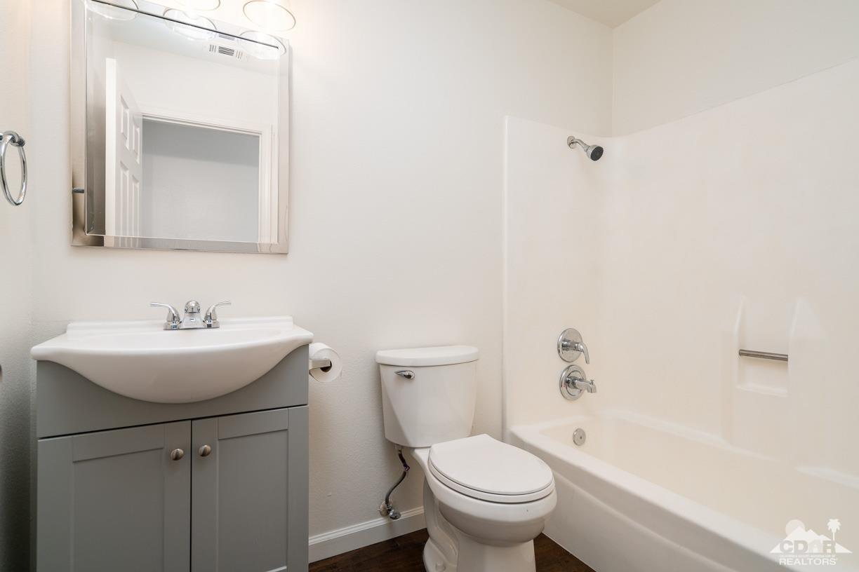 6987 Manhattan Drive Riverside, CA 92506 - Photo 11 of 28 a bathroom with a sink toilet and shower