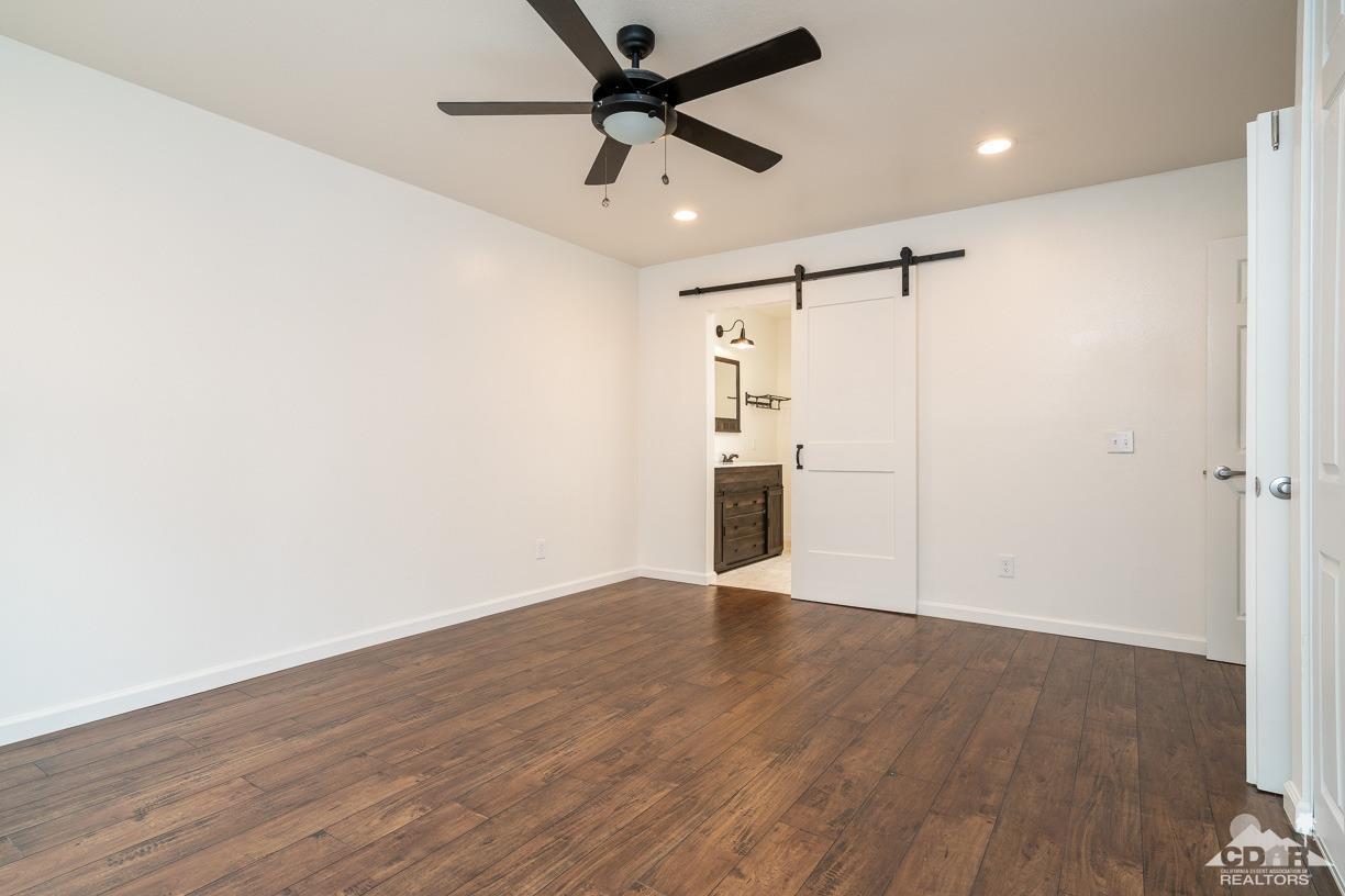 6987 Manhattan Drive Riverside, CA 92506 - Photo 13 of 28 wooden floor in an empty room