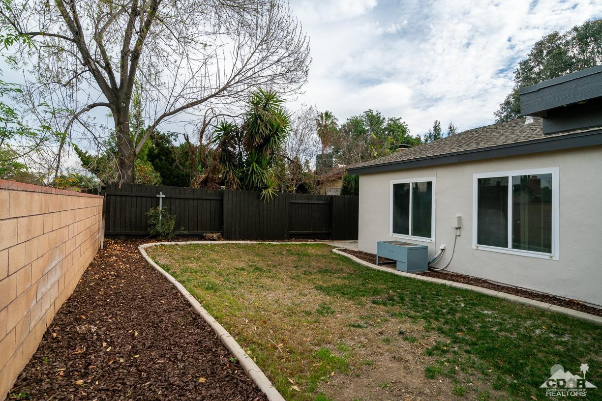 6987 Manhattan Drive Riverside, CA 92506 - Photo 25 of 28 front view of a house with a garden