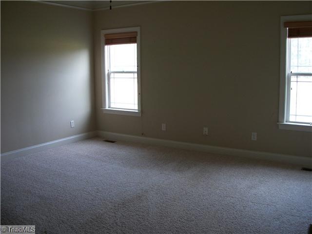 5724 Mabe Drive Oak Ridge, NC 27310 - Photo 11 of 16 Master Bedroom.