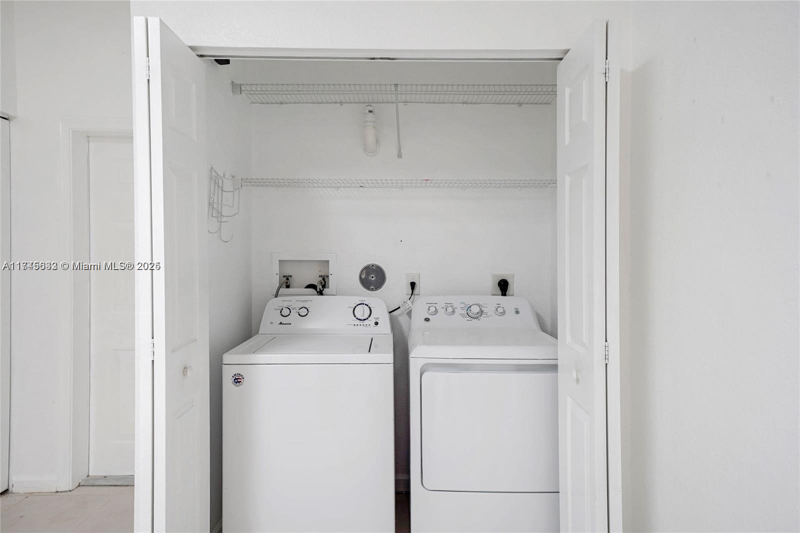 3903 Tree Top Drive Weston, FL 33332 - Photo 13 of 18 a utility room with dryer and washer