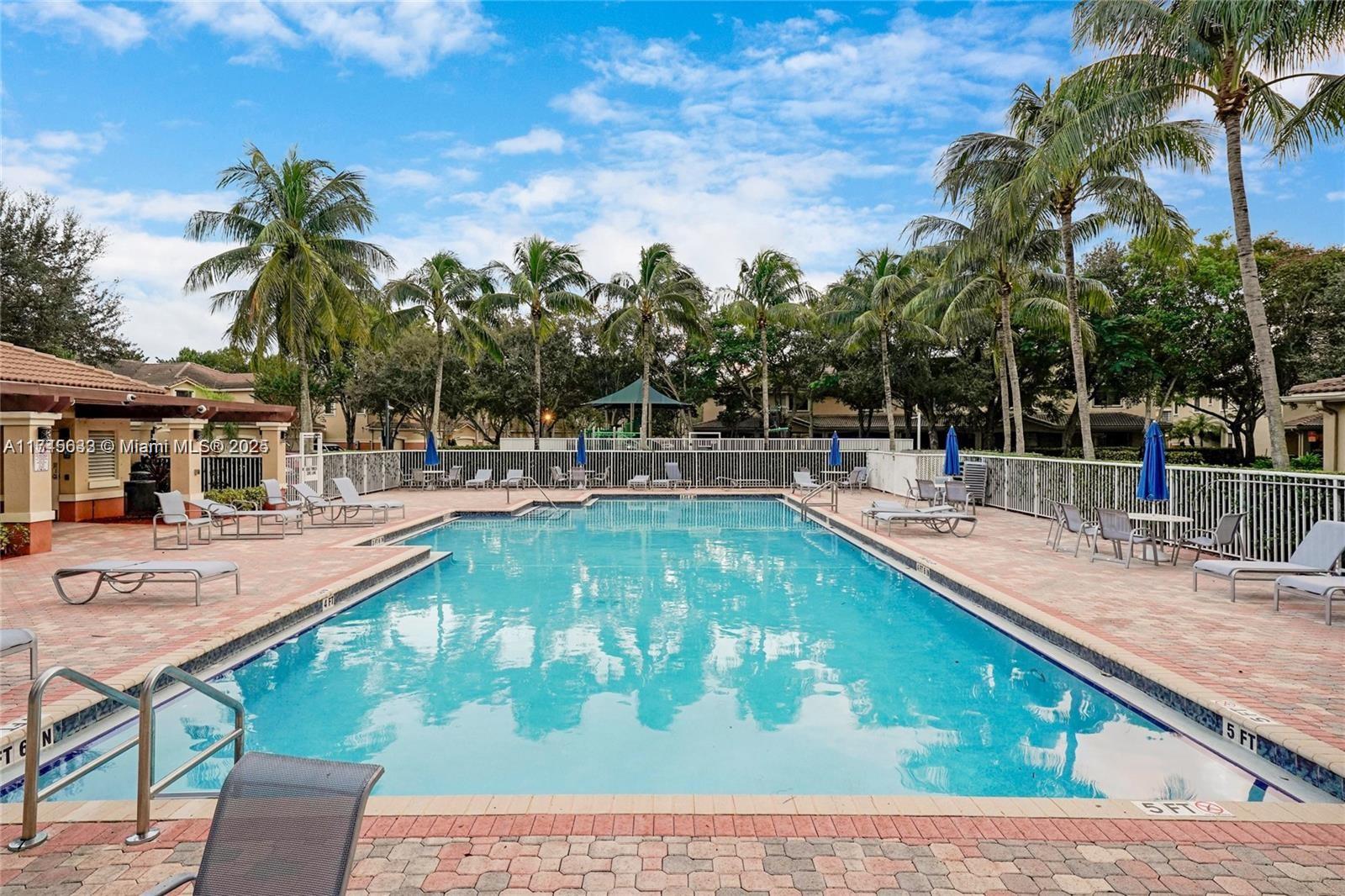 3903 Tree Top Drive Weston, FL 33332 - Photo 17 of 18 a view of a swimming pool with a patio