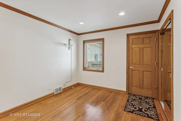 a view of room with window and hardwood floor