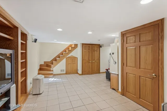 a view of entryway with furniture and stairs