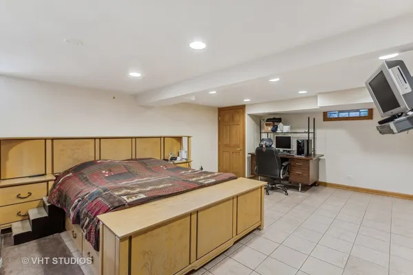 a bed room with a bed and a television