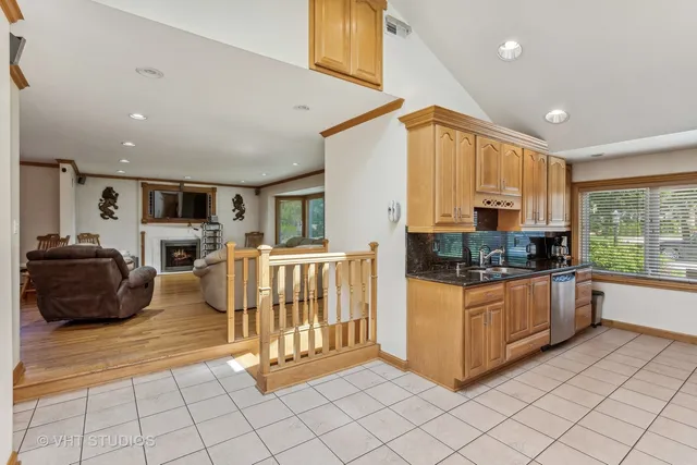 a kitchen with stainless steel appliances granite countertop a stove and a sink