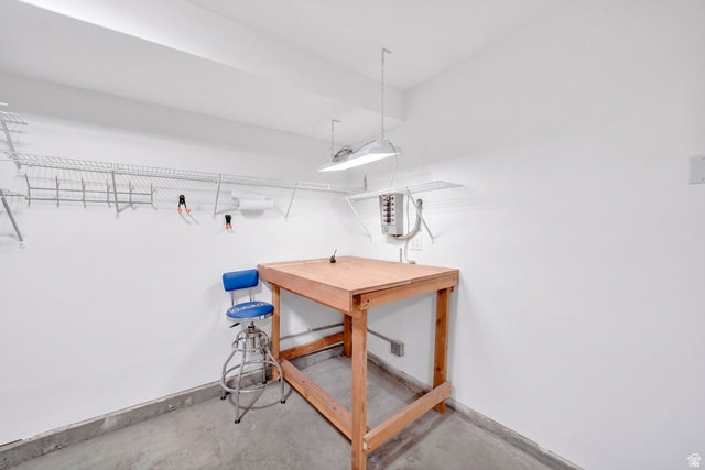 1464 990 West Provo, UT 84601 - Photo 31 of 41 Dedicated utility area featuring a wooden workbench and white walls