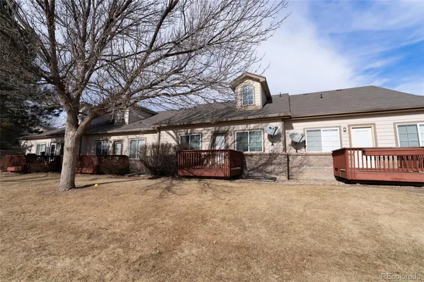 a view of a house with a snow in a yard