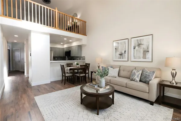 a living room with furniture and a table