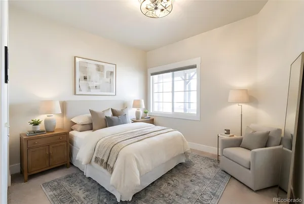 a bedroom with bed and a window