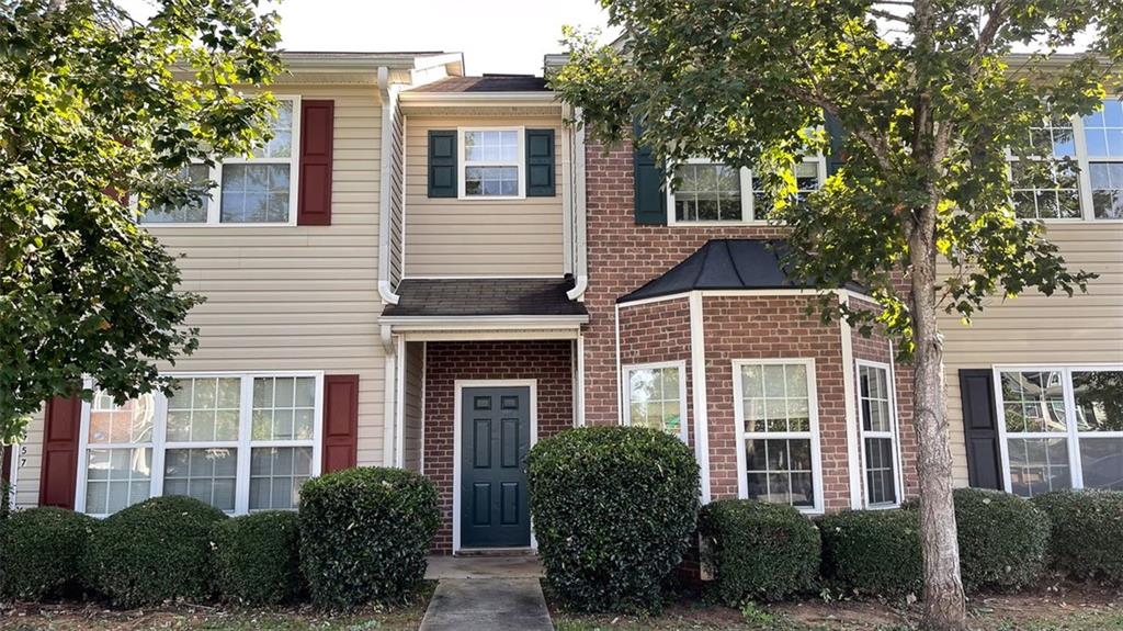 Undisclosed Address Hampton, GA 30228 - Photo 1 of 1 a front view of a house with plants and trees