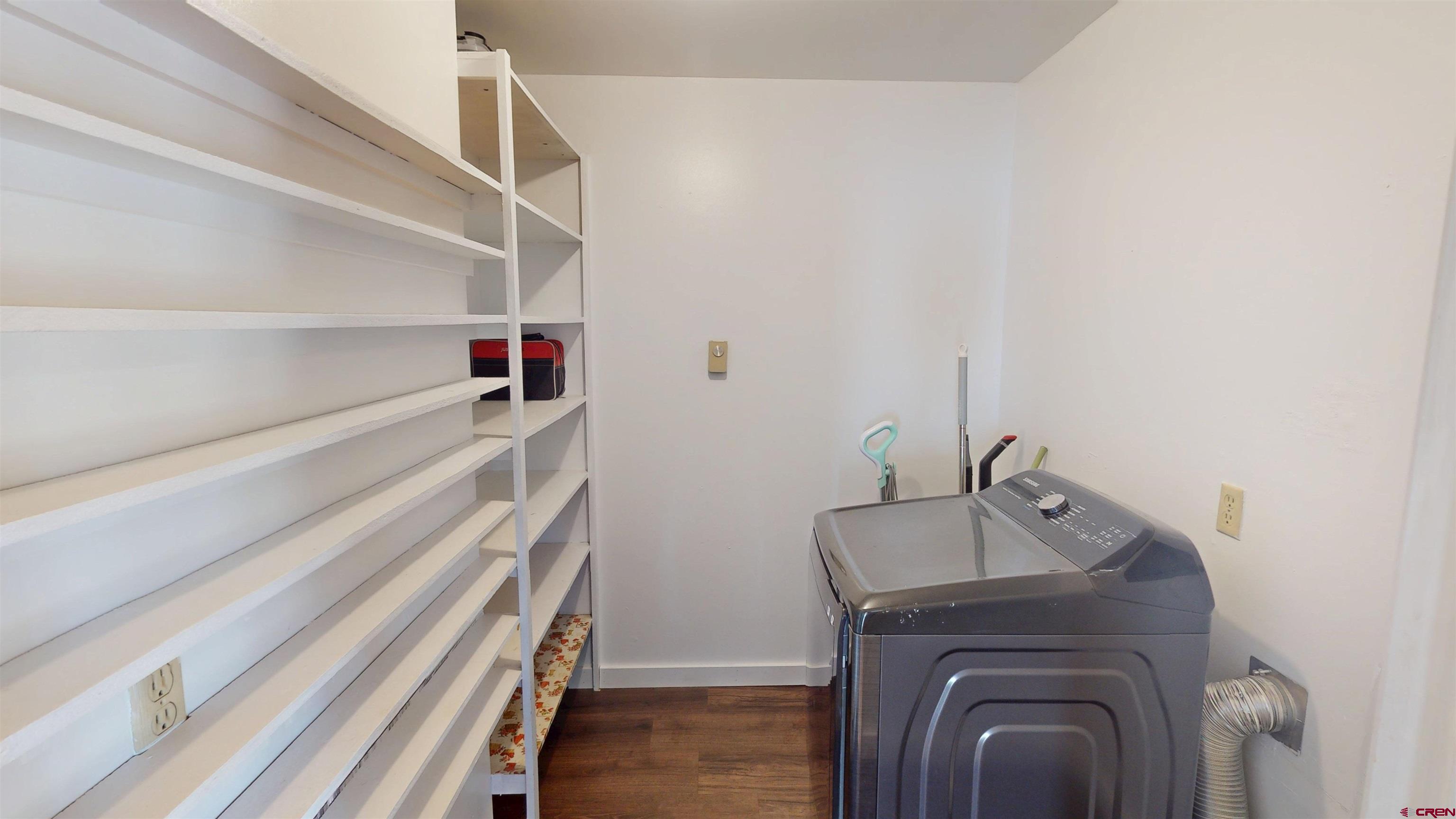 25615 Starner Loop Road Cedaredge, CO 81413 - Photo 12 of 42 a utility room with dryer and washer