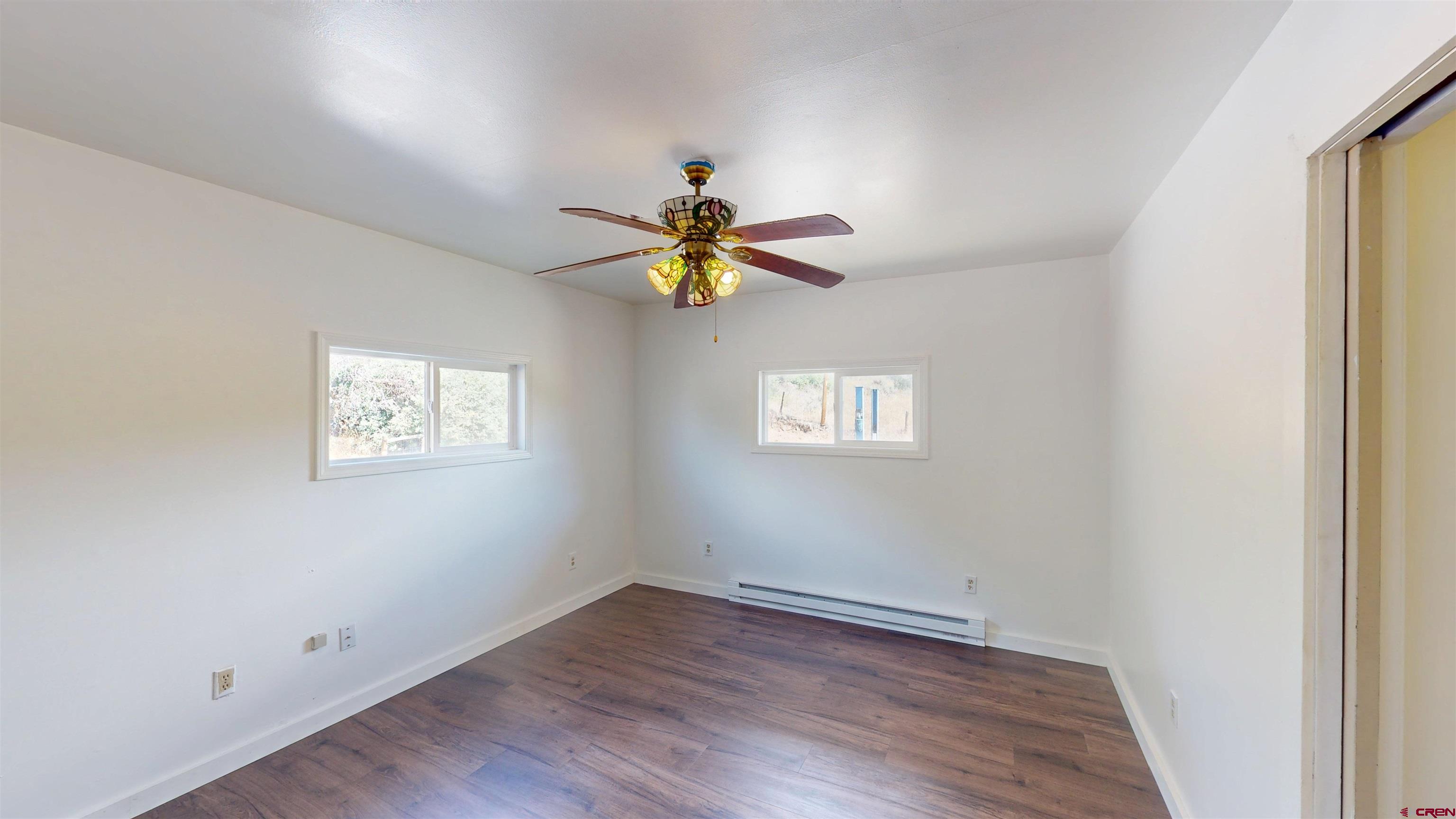 25615 Starner Loop Road Cedaredge, CO 81413 - Photo 17 of 42 a view of an empty room with a window