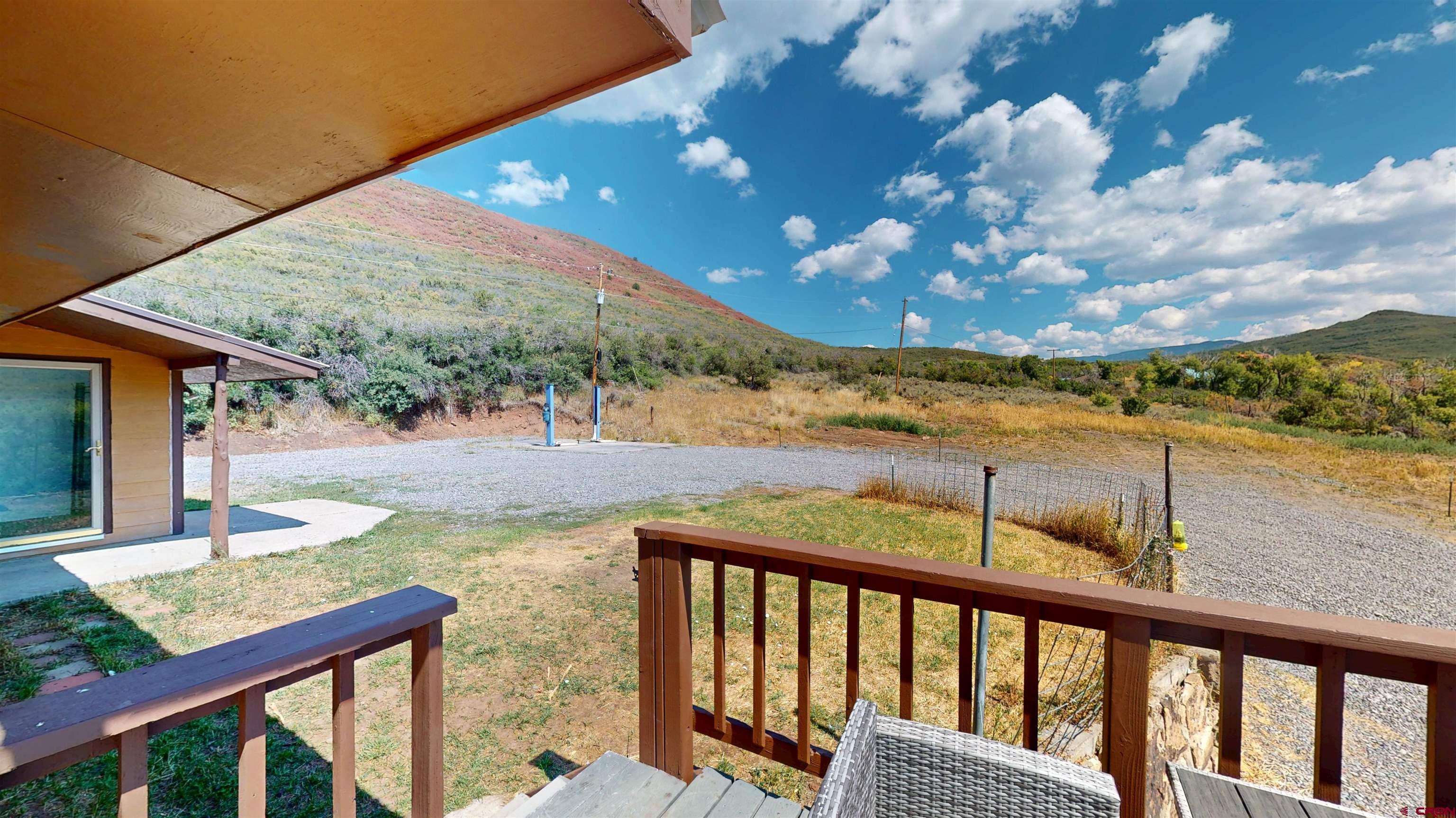 25615 Starner Loop Road Cedaredge, CO 81413 - Photo 35 of 42 a view of a balcony with an outdoor space