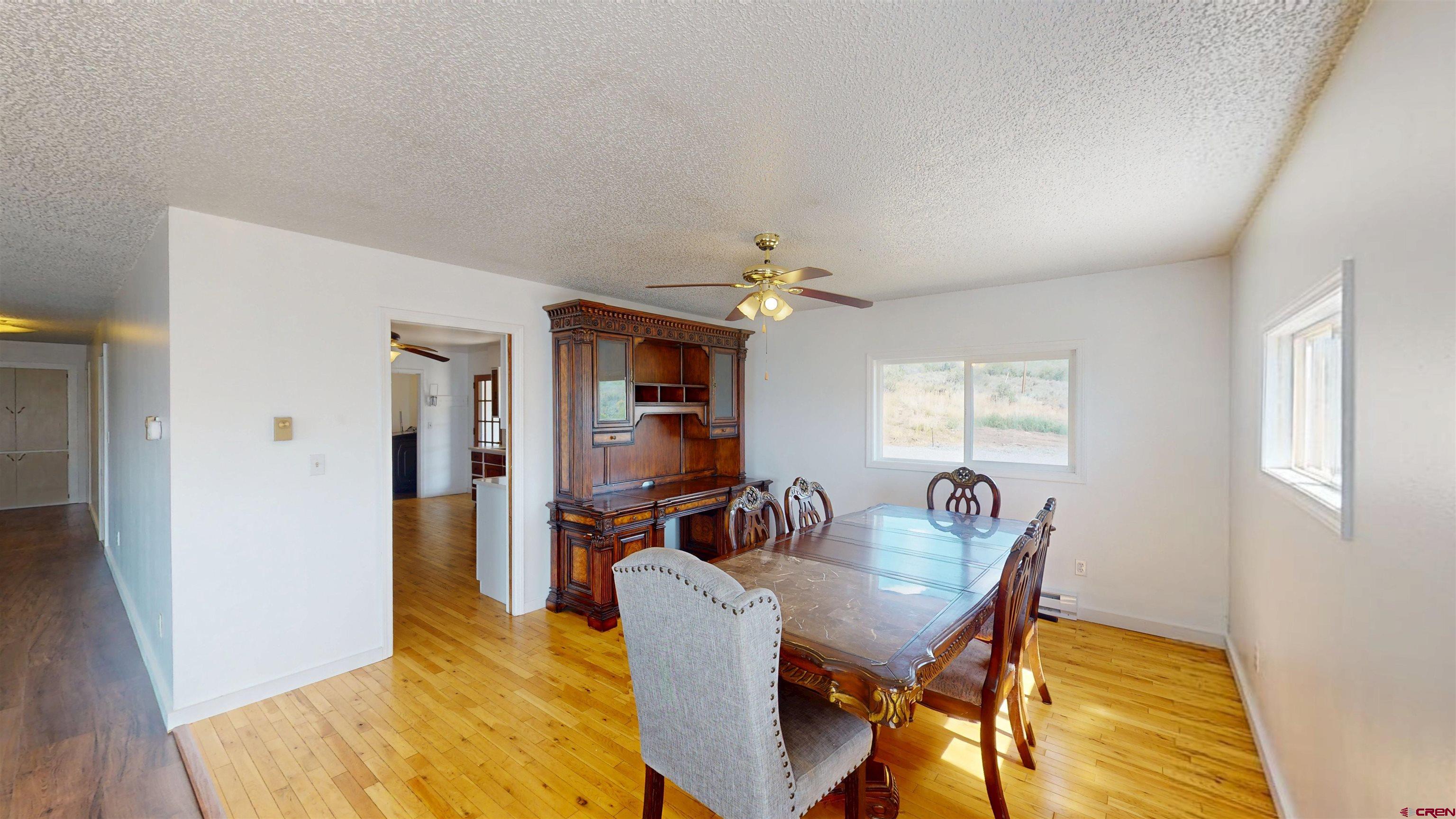 25615 Starner Loop Road Cedaredge, CO 81413 - Photo 6 of 42 a view of a dining room with furniture
