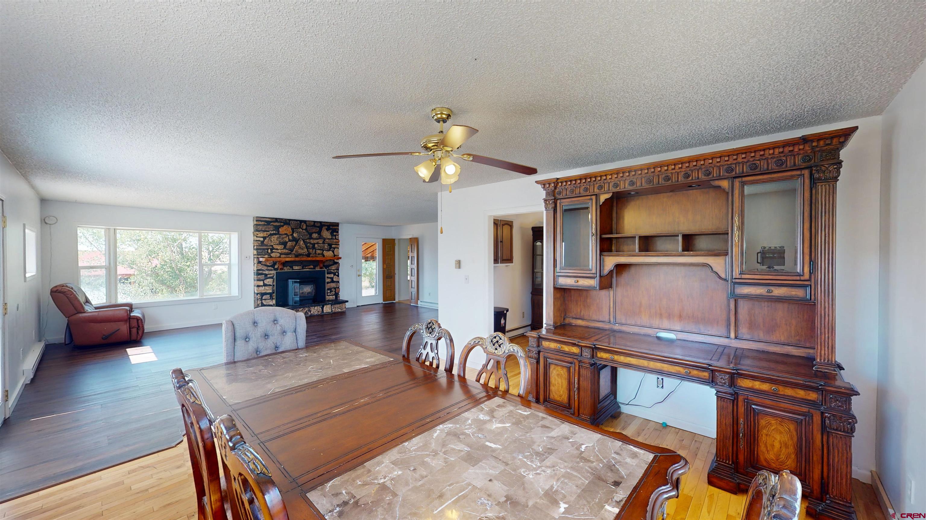 25615 Starner Loop Road Cedaredge, CO 81413 - Photo 7 of 42 a living room with furniture and wooden floor