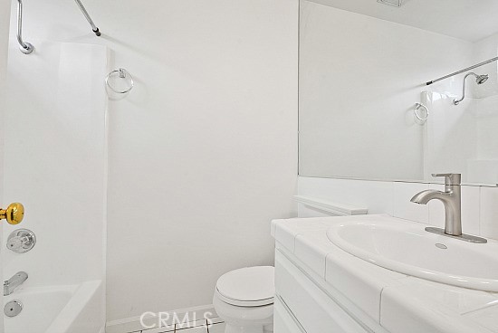105 Alameda, Unit A San Clemente, CA 92672 - Photo 6 of 7 a bathroom with a sink a toilet and shower