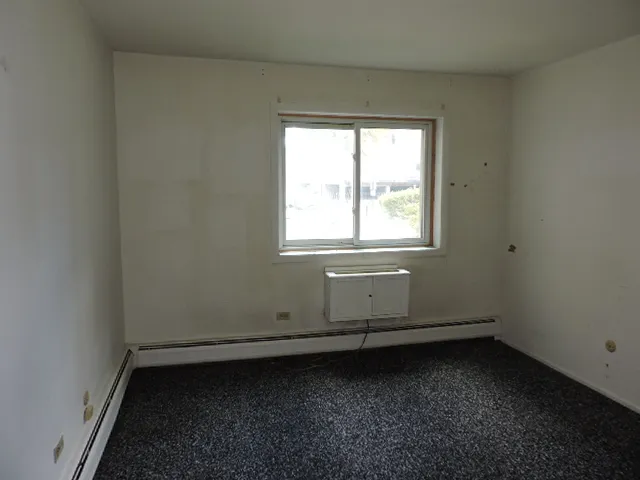 an empty room with a bathroom