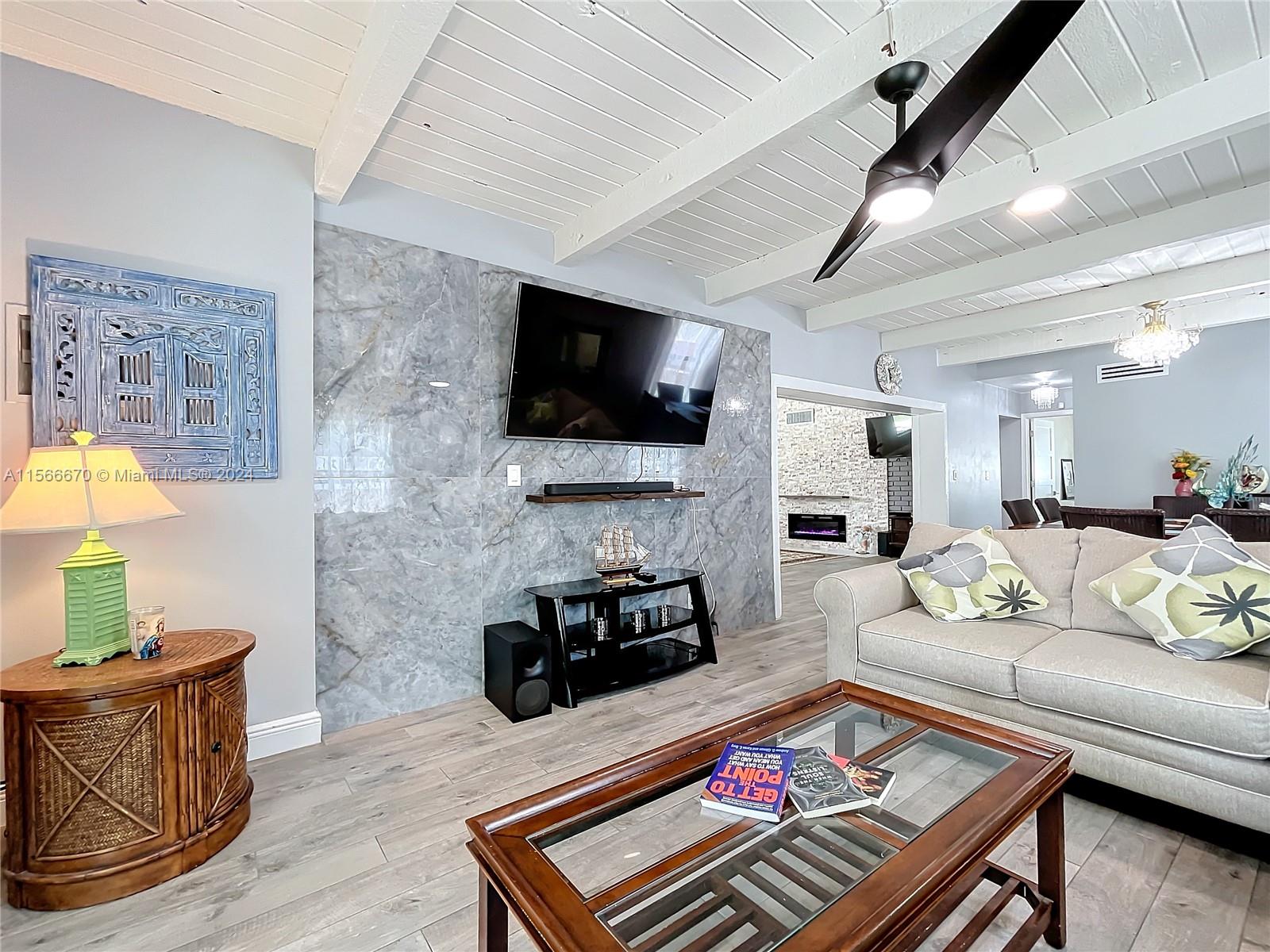 10324 Sleepy Brook Way Boca Raton, FL 33428 - Photo 12 of 29 a living room with furniture and a flat screen tv