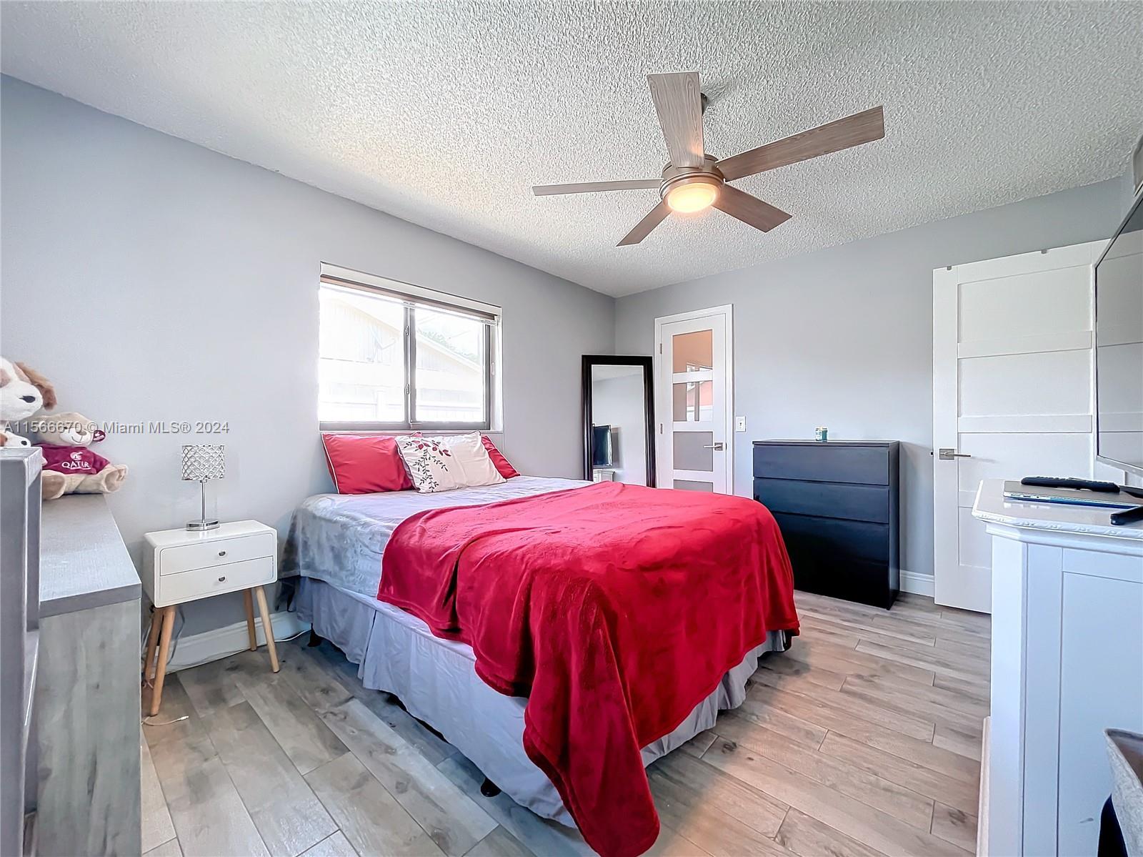 10324 Sleepy Brook Way Boca Raton, FL 33428 - Photo 13 of 29 a spacious bedroom with a bed and a dresser