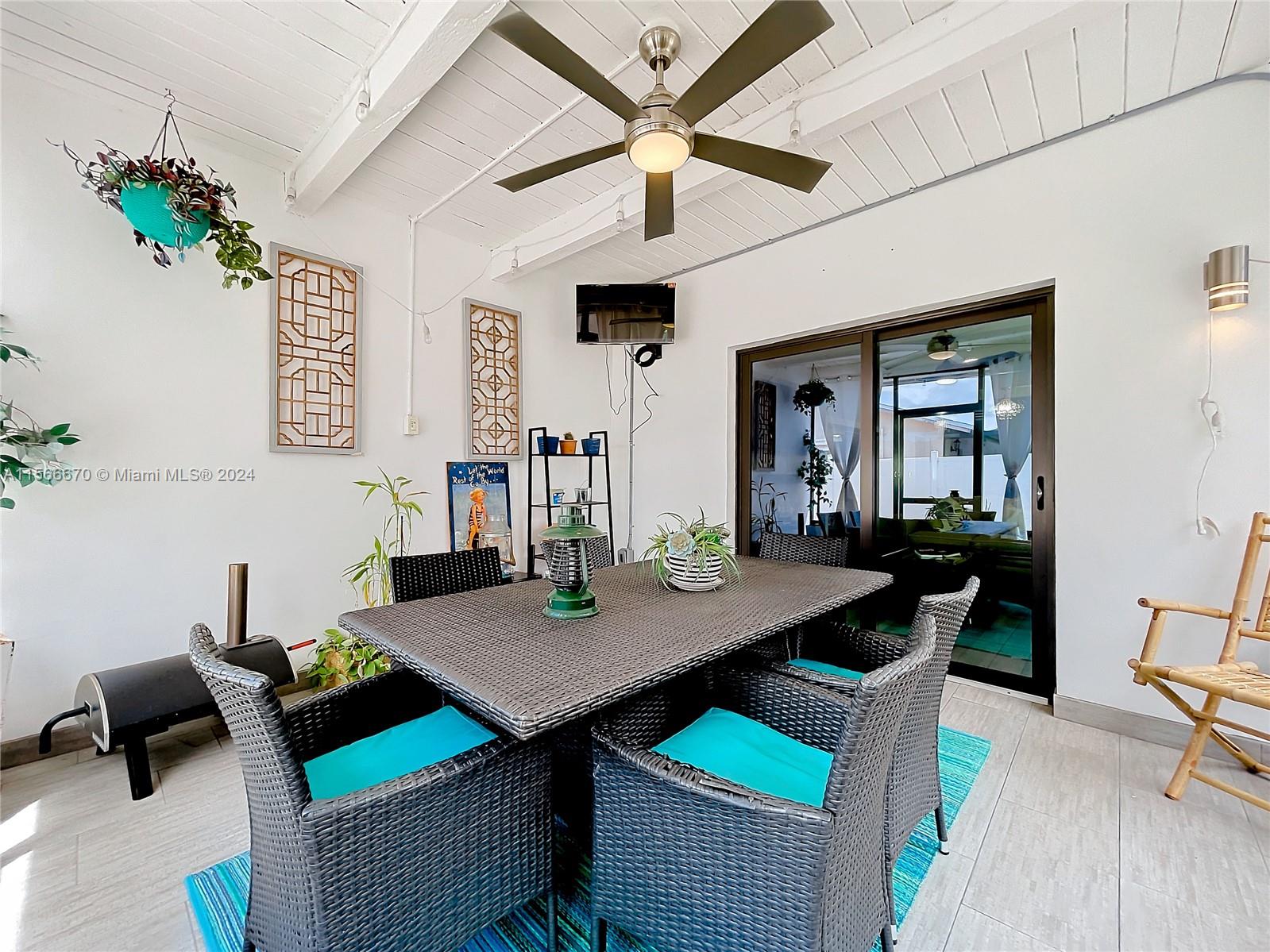 10324 Sleepy Brook Way Boca Raton, FL 33428 - Photo 19 of 29 a view of a dining room with furniture and a table