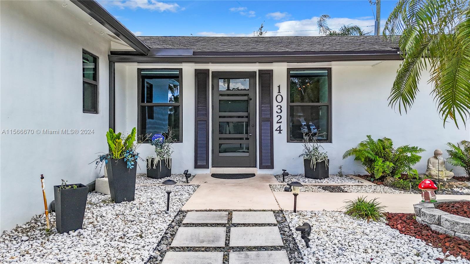 10324 Sleepy Brook Way Boca Raton, FL 33428 - Photo 2 of 29 a view of a entryway door front of house
