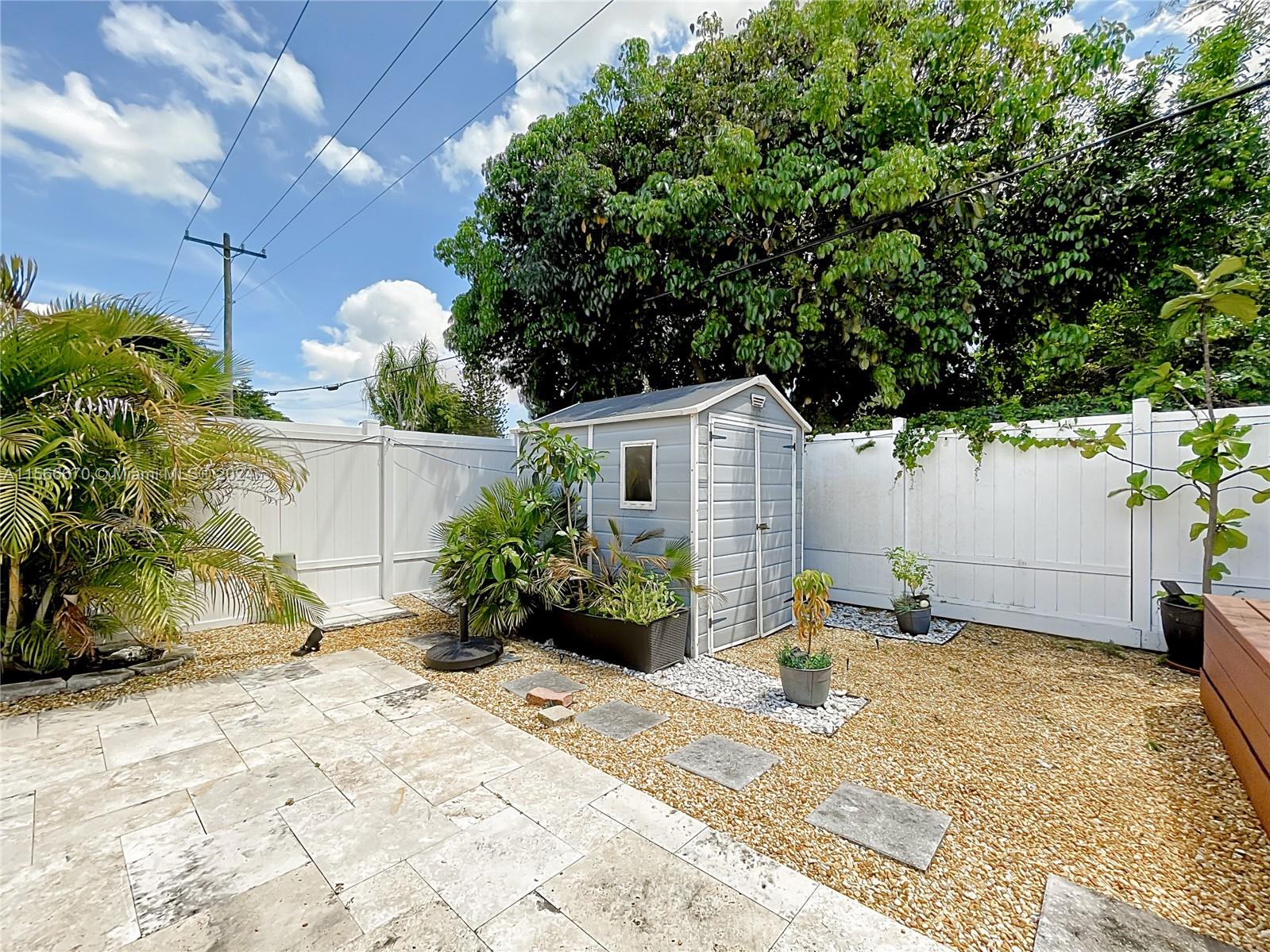 10324 Sleepy Brook Way Boca Raton, FL 33428 - Photo 23 of 29 a view of a back yard of the house