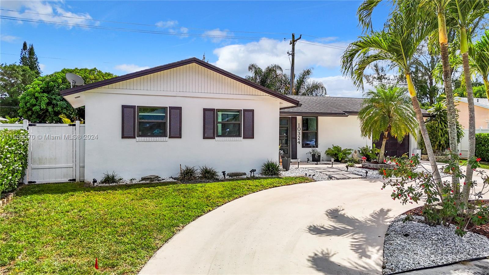 10324 Sleepy Brook Way Boca Raton, FL 33428 - Photo 3 of 29 a view of a yard in front of a house