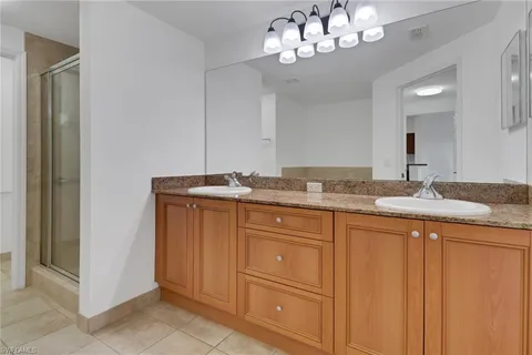 a spacious bathroom with a bathtub and a shower