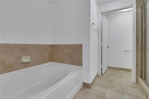 a bathroom with a bathtub and shower