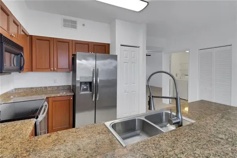 a view of a kitchen with electric appliances