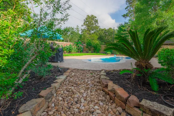 a view of a backyard of the house