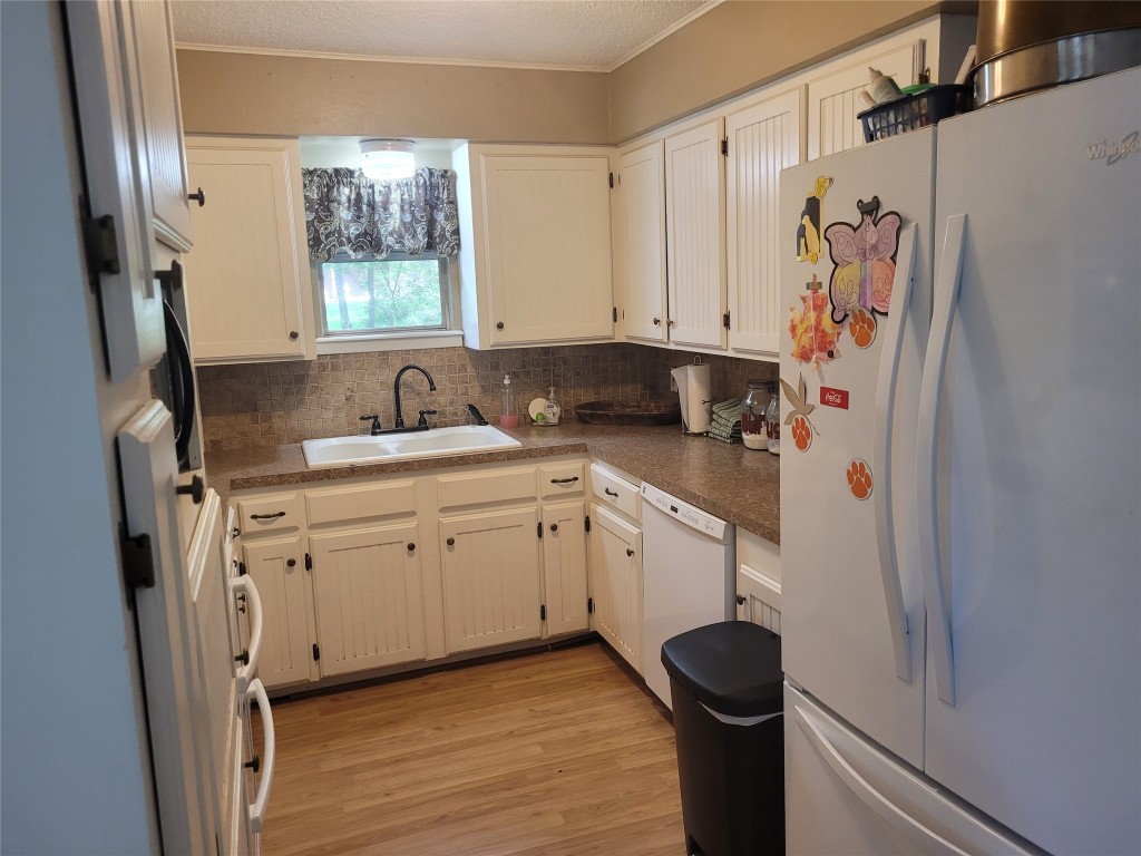 20 Connor Lane Huntsville, TX 77320 - Photo 15 of 41 a kitchen with stainless steel appliances white cabinets and a refrigerator