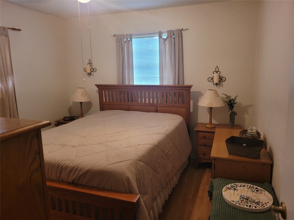 20 Connor Lane Huntsville, TX 77320 - Photo 22 of 41 a bed sitting in a bedroom next to a window