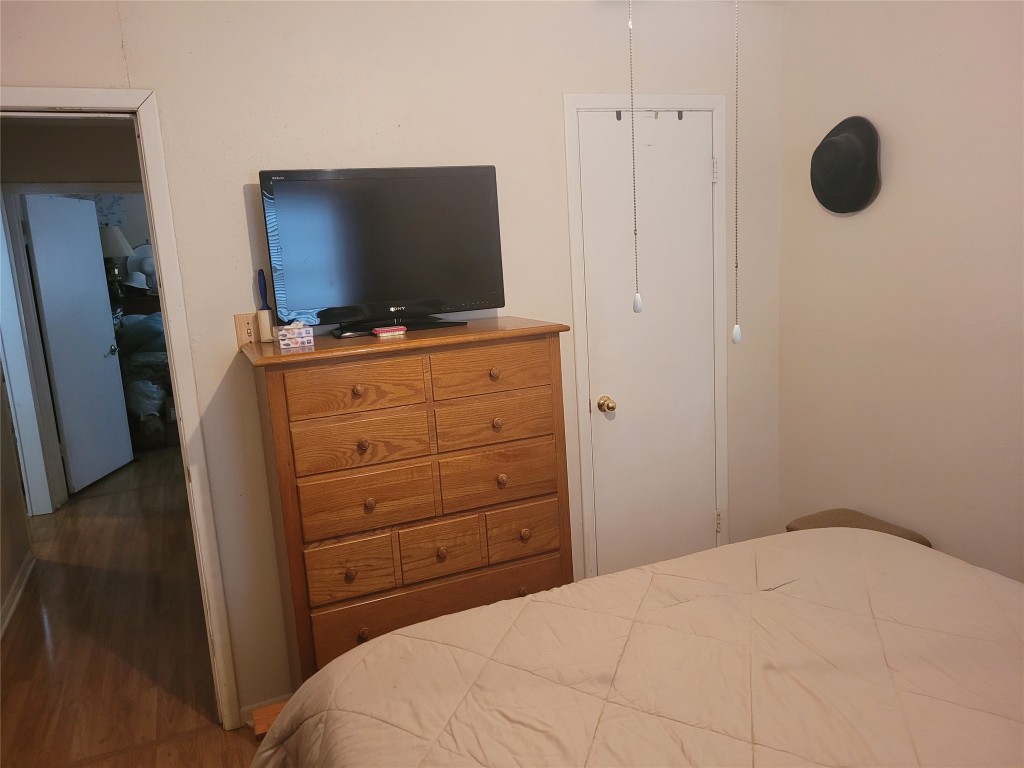 20 Connor Lane Huntsville, TX 77320 - Photo 23 of 41 a bedroom with a bed and a flat screen tv