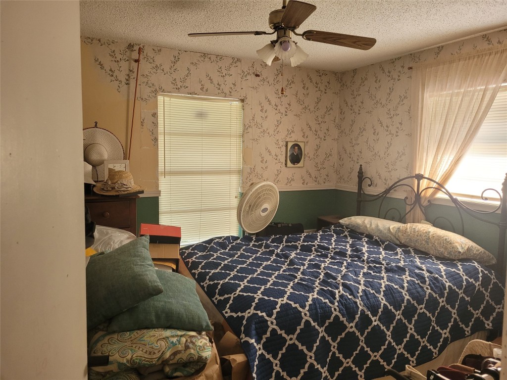 20 Connor Lane Huntsville, TX 77320 - Photo 24 of 41 a bedroom with a bed and wooden floor