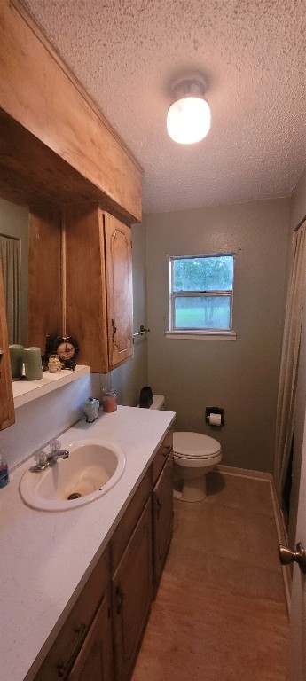 20 Connor Lane Huntsville, TX 77320 - Photo 29 of 41 a bathroom with a sink a toilet a mirror and vanity