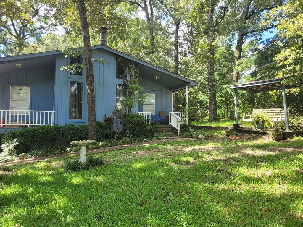 20 Connor Lane Huntsville, TX 77320 - Photo 5 of 41 a front view of a house with a yard